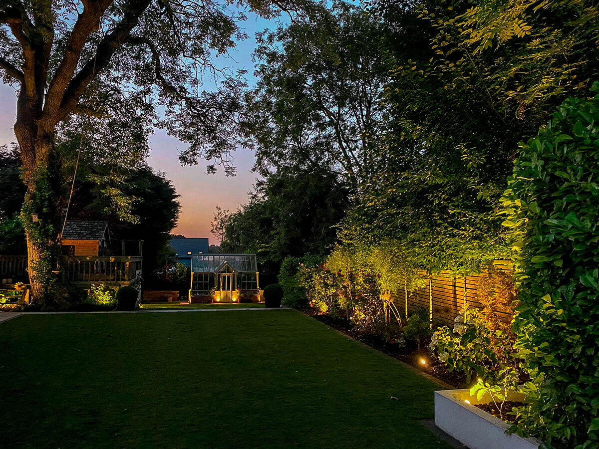 Landscaped garden with evening lighting